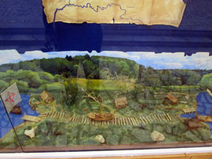 Maquete del proceso antiguo de arrastrar una lancha por tierra firme, lo que en ruso se llama vólok.